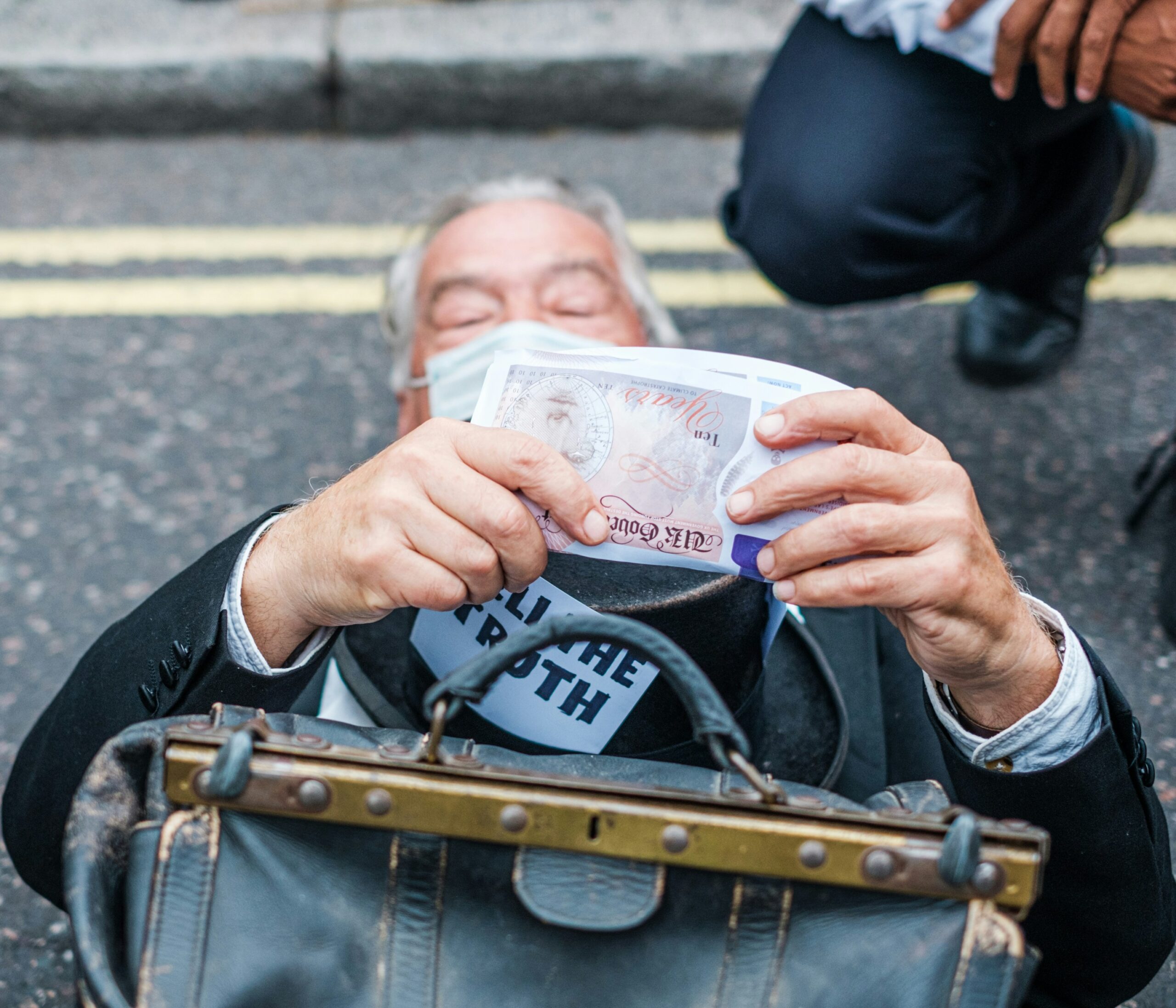 A frustrated traveler holding a torn-up insurance policy