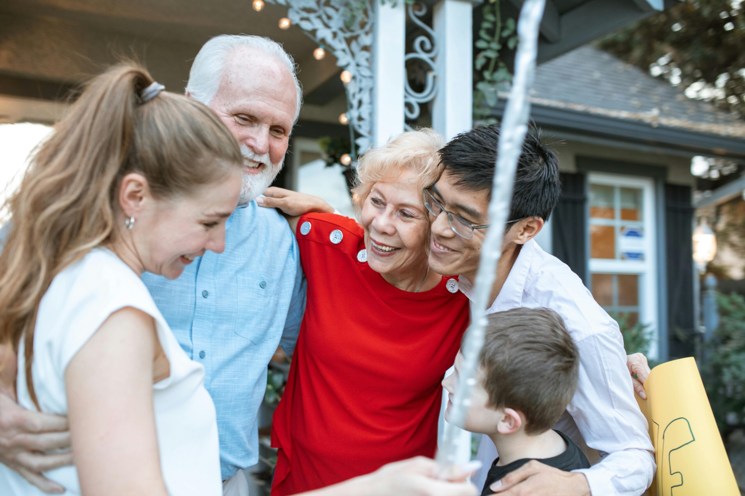 A joyful reunion photo of a man hugging his family after being released safely.