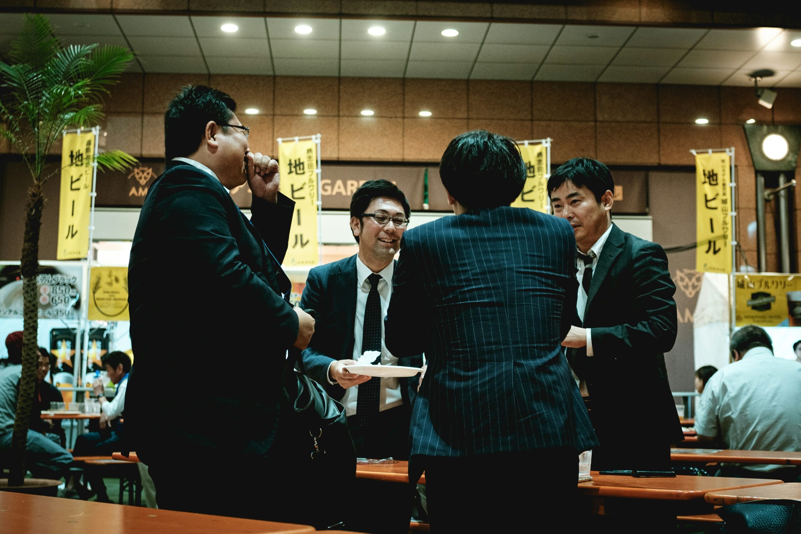 Man on phone negotiating while surrounded by documents