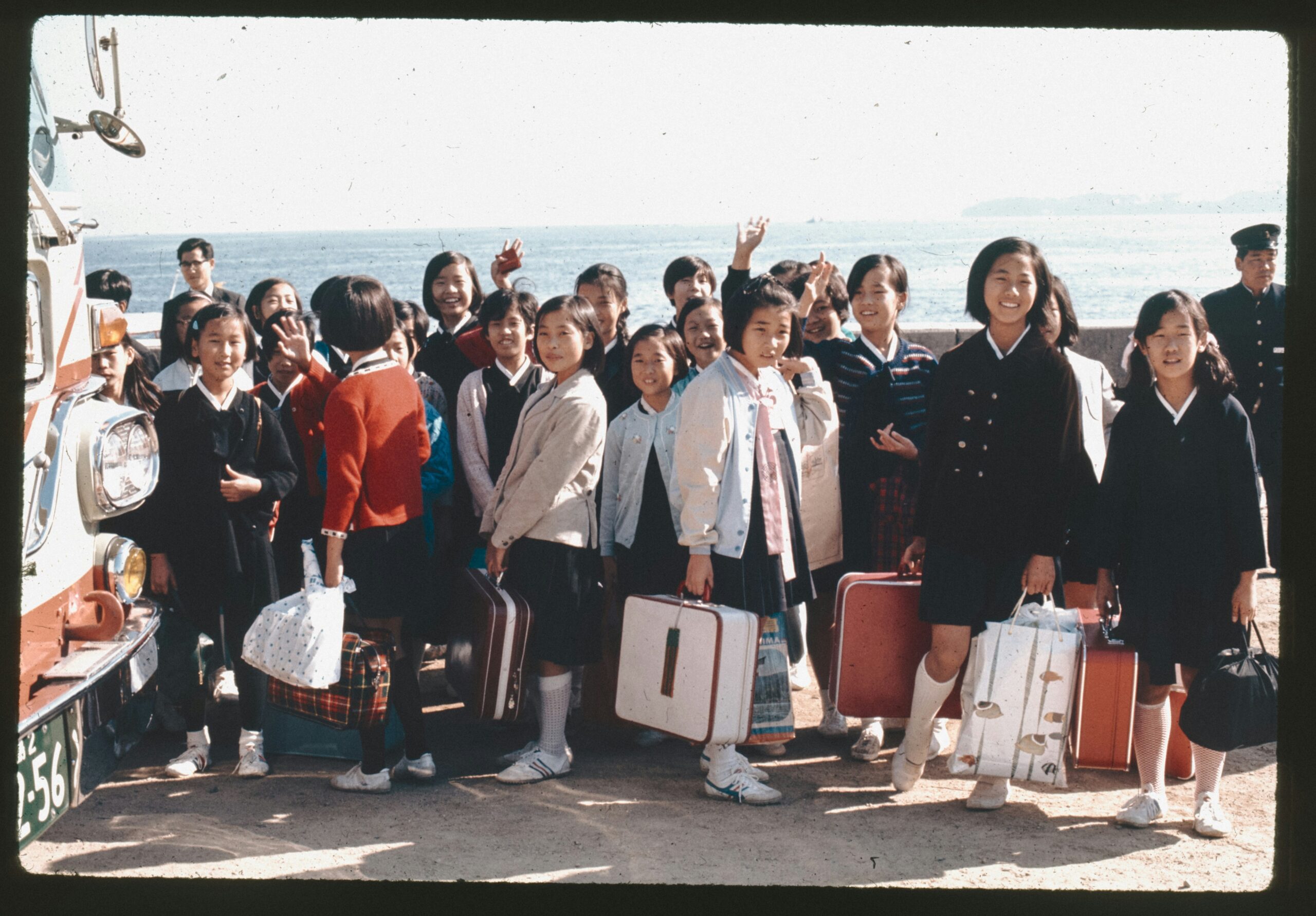Photo of a volunteer being reunited with their family after successful negotiation