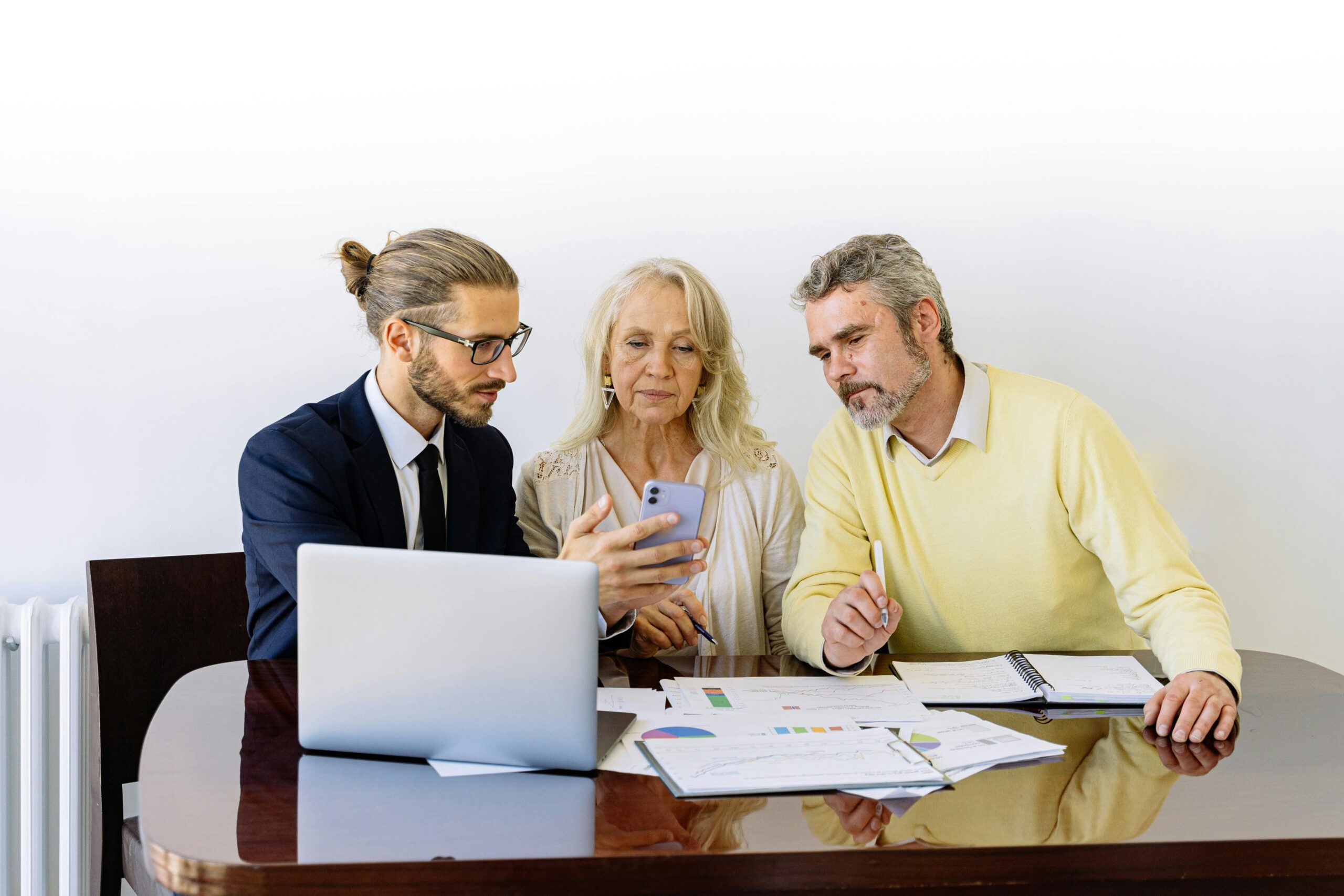Photo of an insurance agent discussing paperwork with a client
