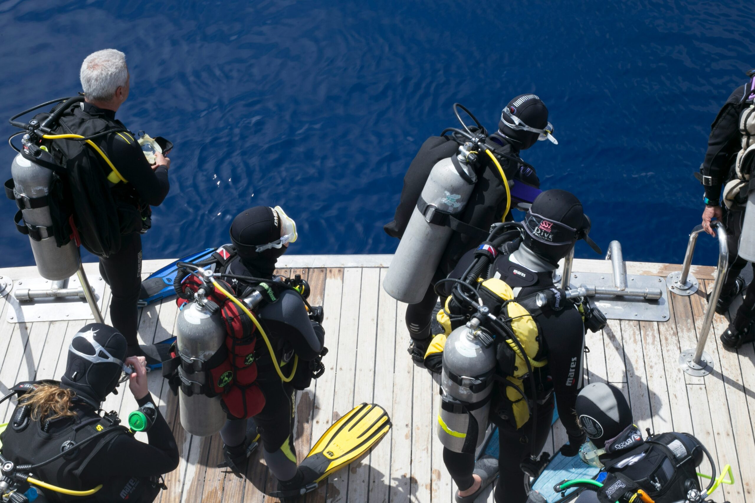 Photo of reunited traveler and rescuers highlighting successful resolution from crisis response teams