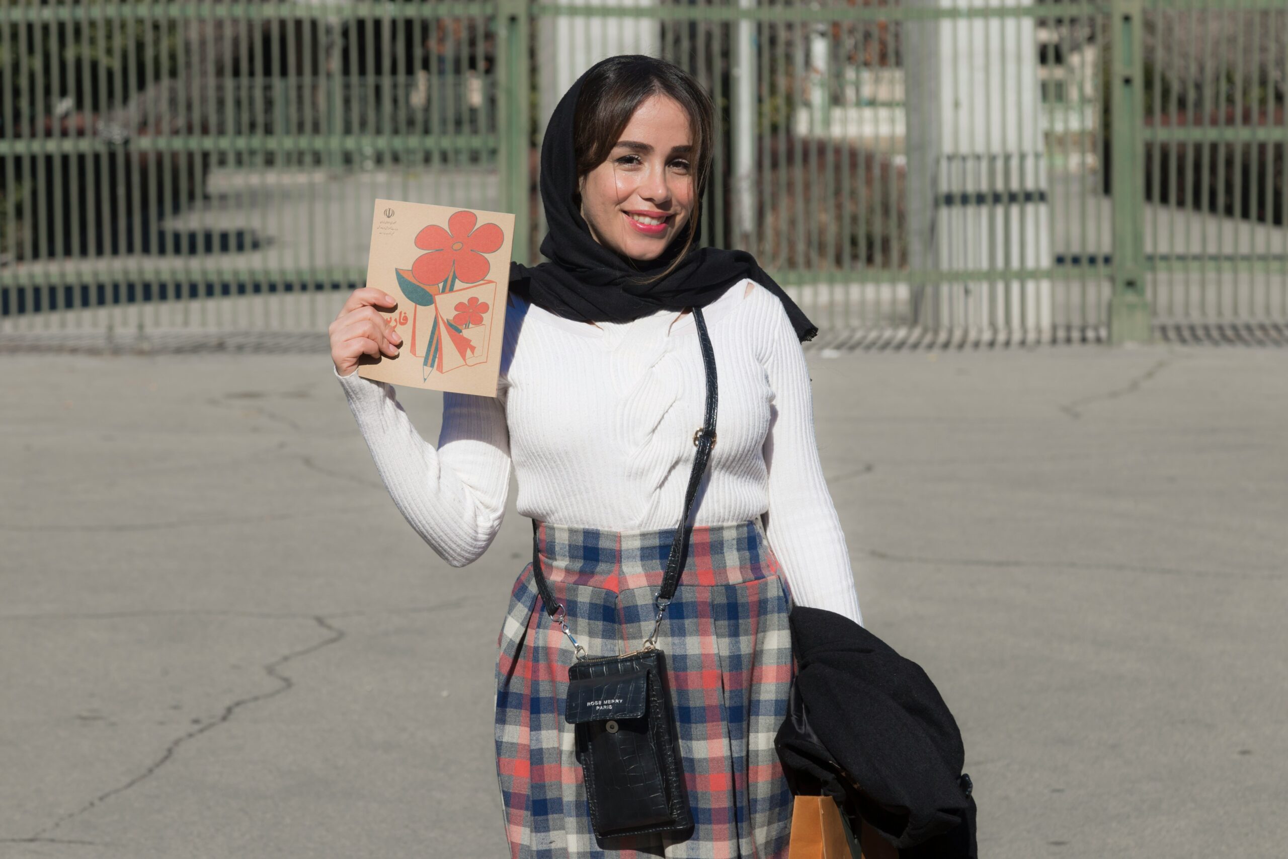 Photo of Sarah holding a map with a caption reading 'Safe Travels Start With Smart Planning'